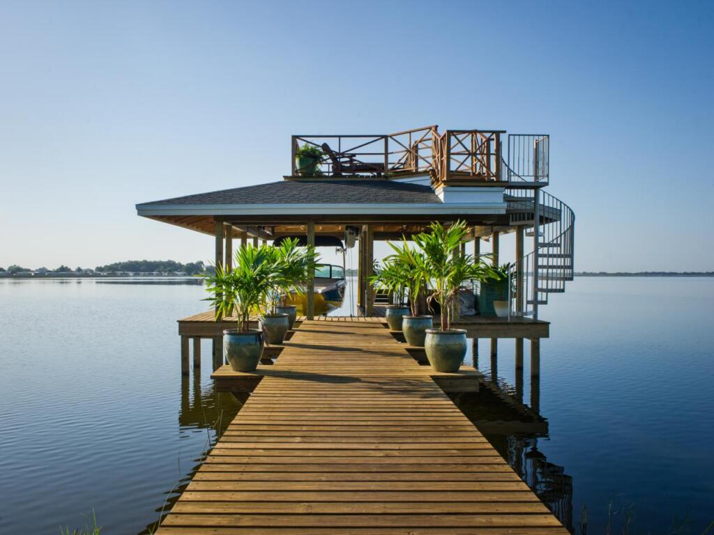 Dock with tropical themed boat house in Florida