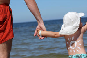 parent preparing to teach a child to swim