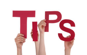 hands holding up letters that spell "tips"