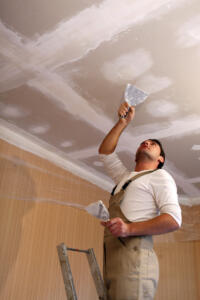 man working on drywall