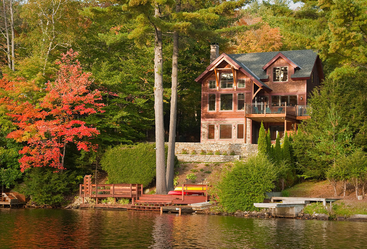 Vermont Lake Home on Shoreline during autumn | Lake Homes Realty