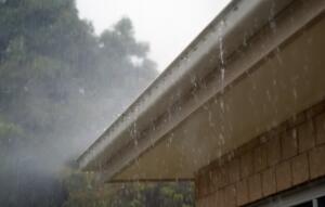 rain coming out of gutters