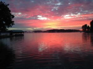 purple, yellow and pink sunset over open water