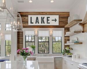 white and wooden kitchen with lake sign 