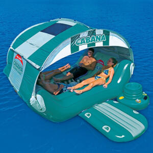 4 people relaxing on open water on cabana float