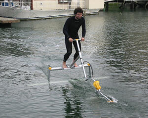 men riding on water bike 