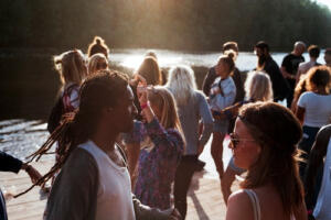 young people partying on the lake