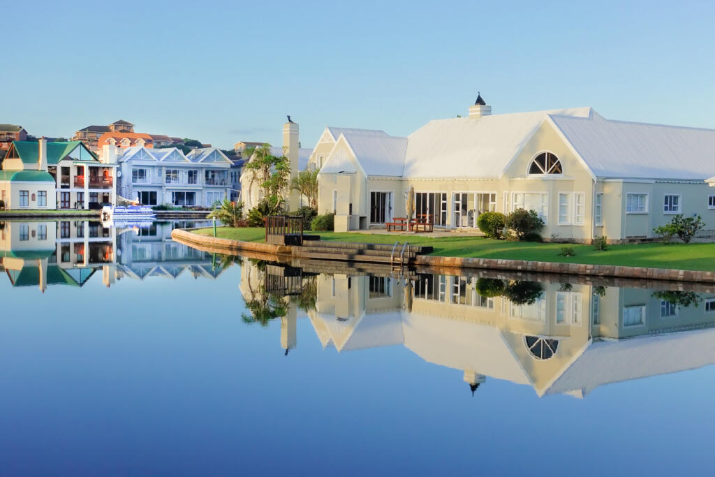 white house on waterfront, features common lake real estate term "bulkhead."