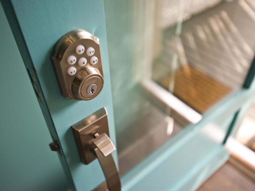 Smart lock on blue glass front door