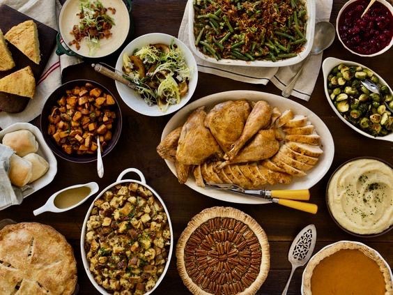 Thanksgiving Turkey Day Friendsgiving dinner laid out on table