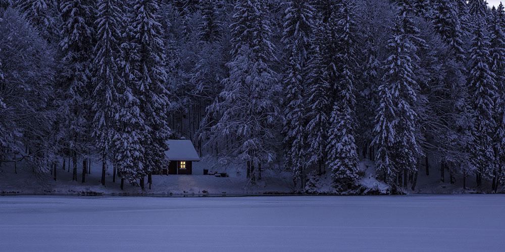 Lake house on a frozen lake