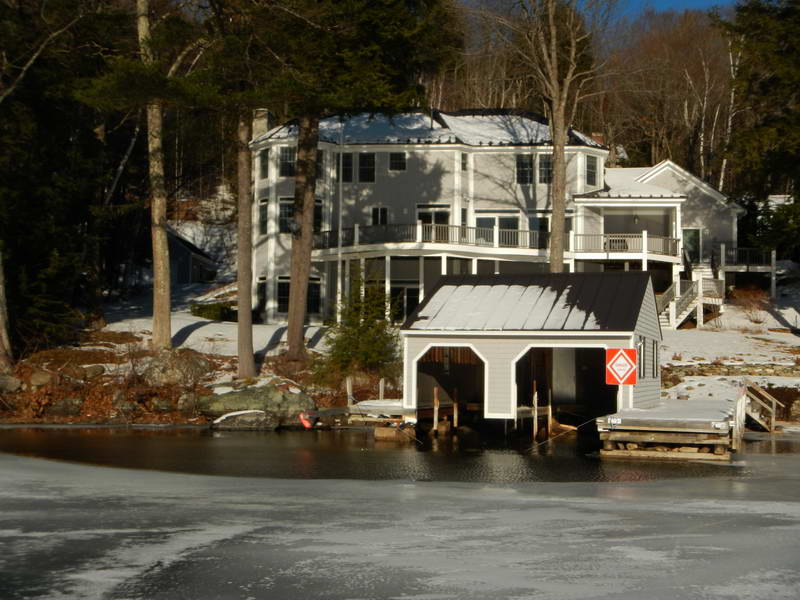 Boathouse deicer with warning sign