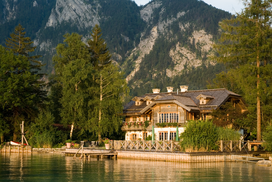 grand beautiful lake house building and maintaining a seawall on the lake