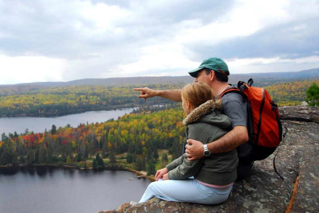 Father pointing to Moosehead Lake with daughter 