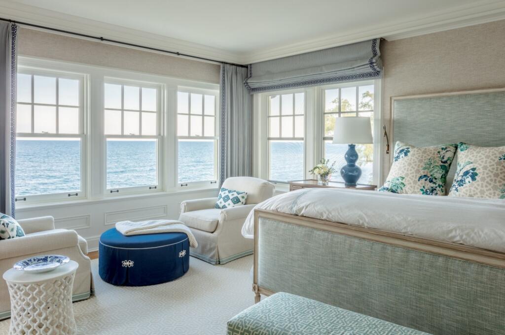 Nautical themed bedroom with view of lake