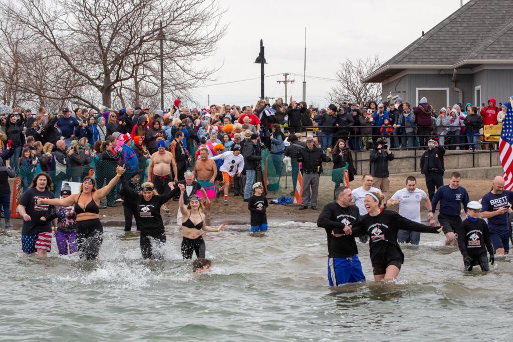 Participants take to the icy waters at Canandaigua Lake, NY