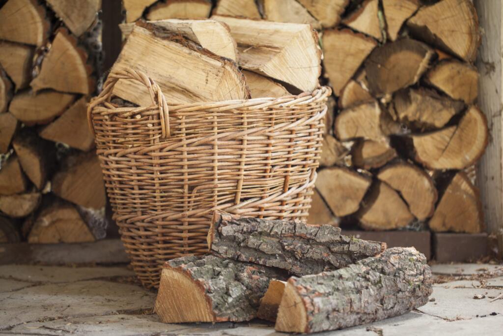 locally sourced chopped firewood in basket