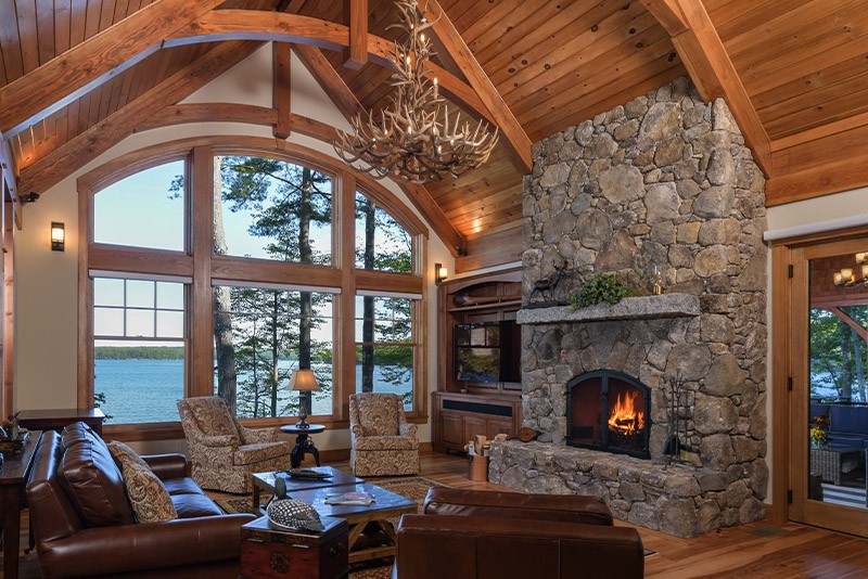Lake house with stone fireplace How to Get the Most Out of Your Wood Fireplace This Winter

