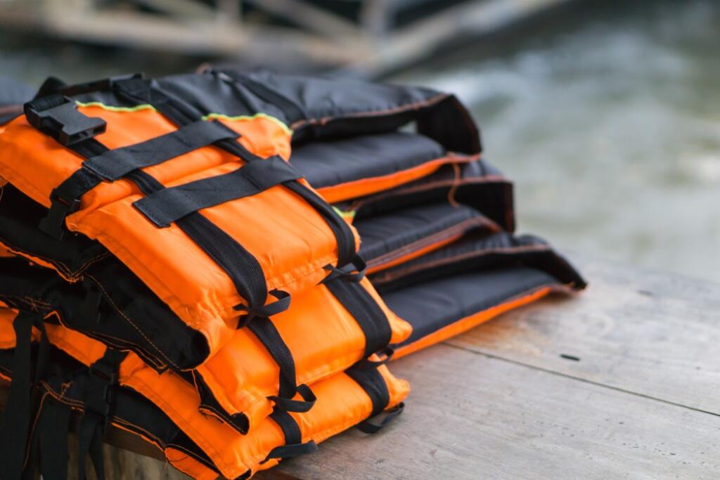 Life jackets laying on lake deck how to properly store personal flotation devices