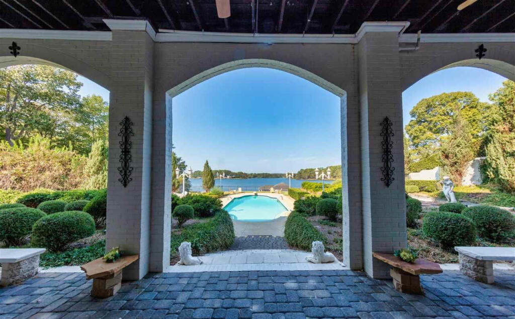 Veranda and pool view in lake house on Lay Lake French Chateau