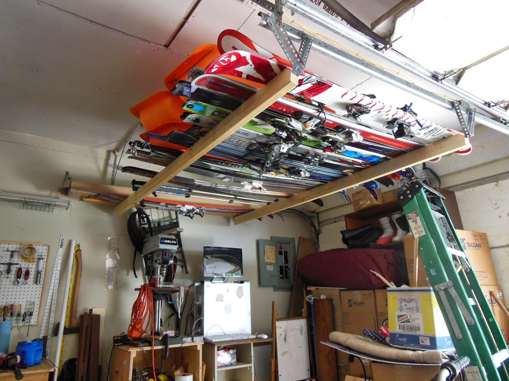Lake gear organization garage ceiling water skis
