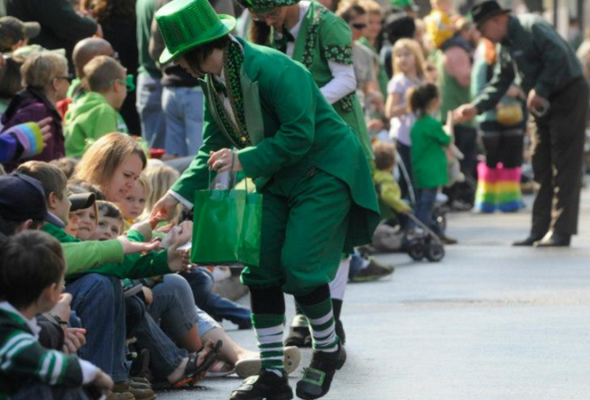 st patrick's day parade handing out candy