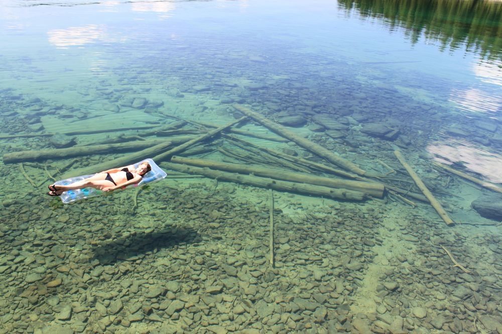 Woman floating on clear Flathead lake