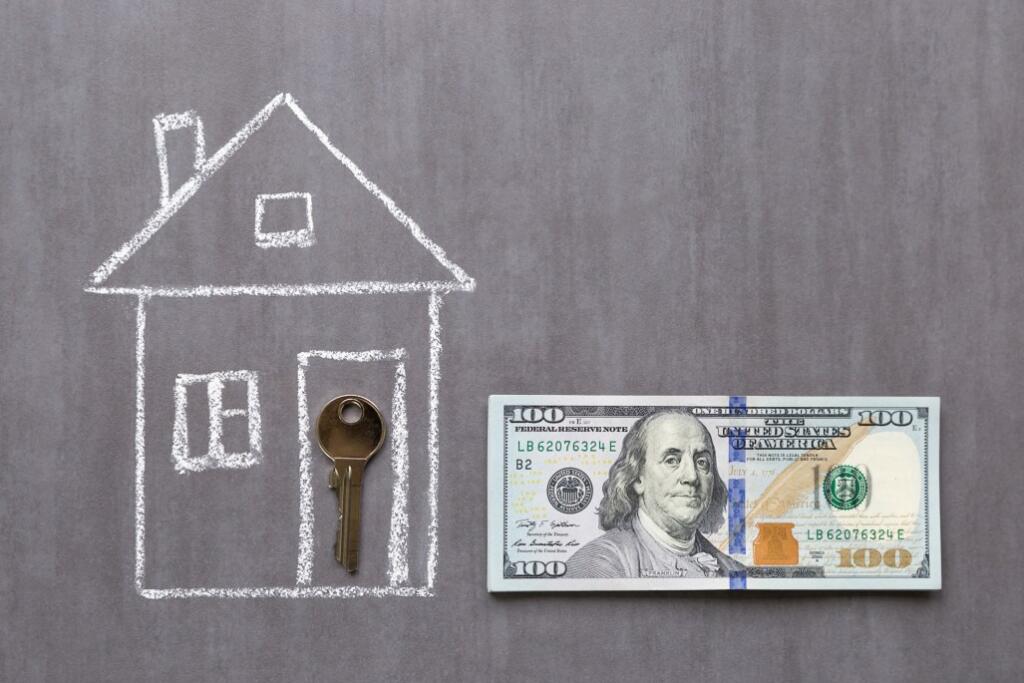 chalk drawing of for-sale-by-owner-house with key in doorway next to $100 bill