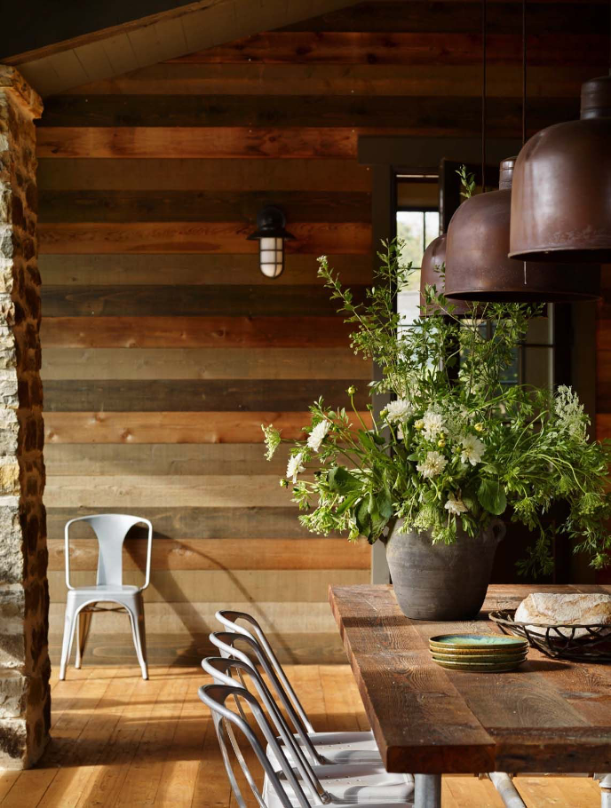 reclaimed wood feature wall in rustic lake home dining room