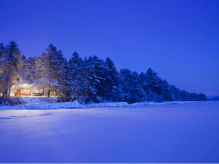 Lake home in the snow on Lake Winnipesaukee, New Hampshire.