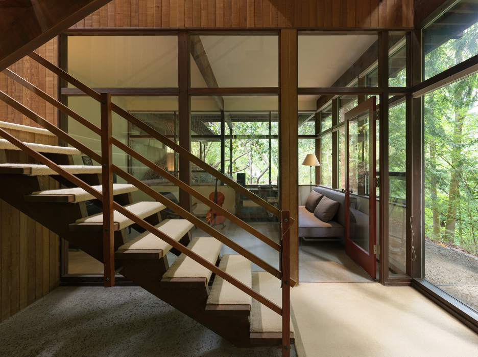 Open-tred staircase at entrance of Alden Mason Home on Lake Washington with music studio in background