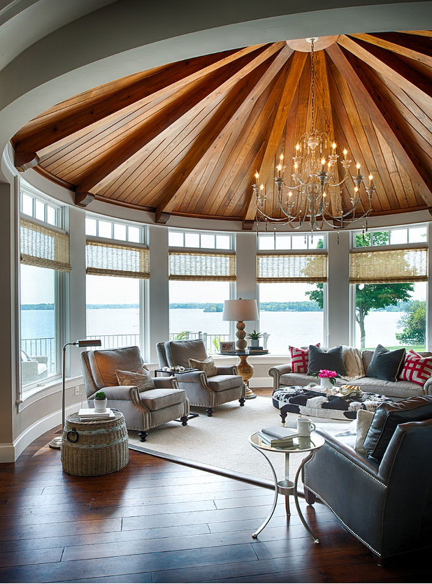 Mid-Atlantic Lake region sunroom with domed ceiling feature, chandelier, rotunda-like space with plush seating, area rug, wood floors