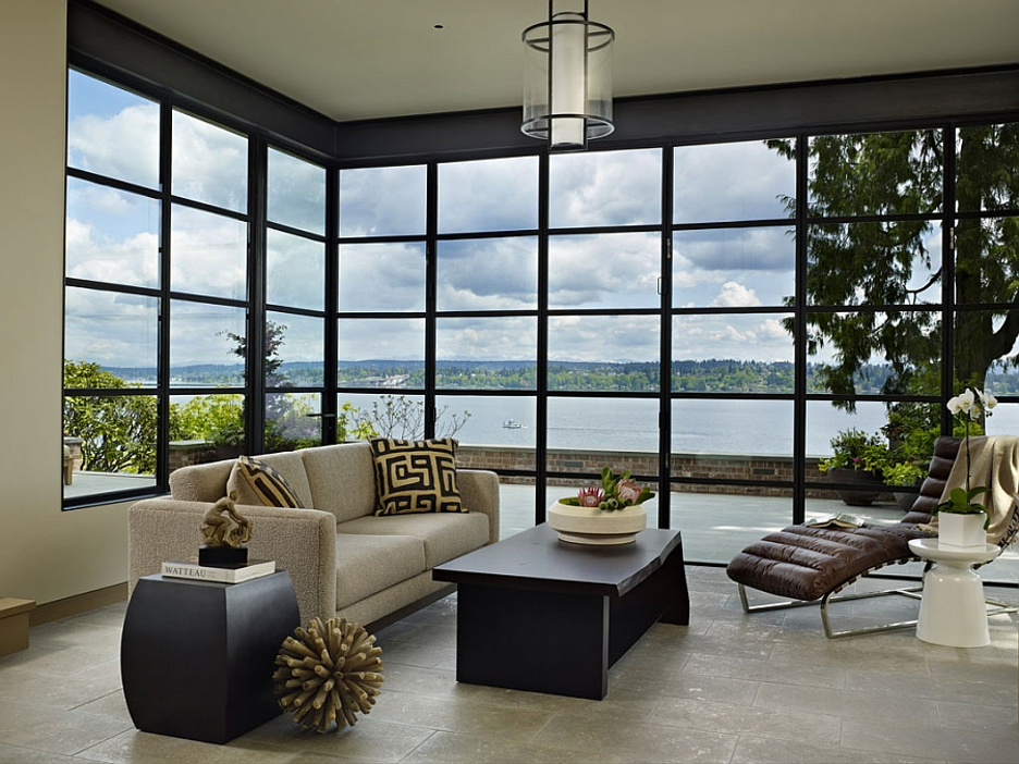 Pacific Northwest Lake region sunroom with expansive glass walls, lake views, mid-century modern neutral furniture, modern accents