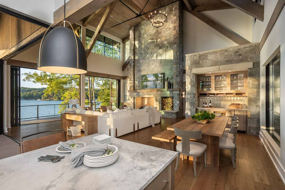 Modern Lake home design 2025 showcasing open floorplan integrating kitchen, dining, living room, and outdoor spaces